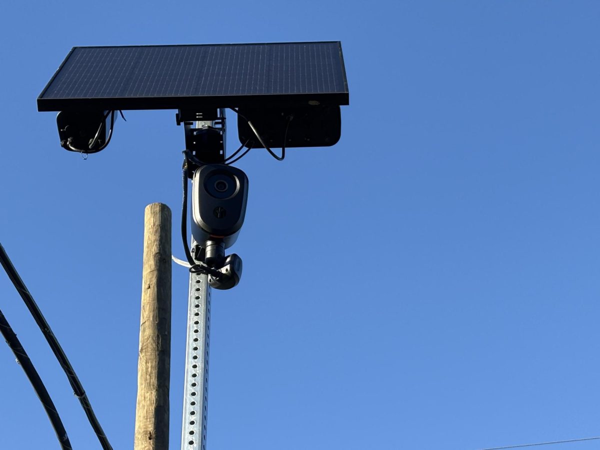A Flock camera nearby Holland Township School. The camera watches the road leading up the school, presumably to see if people are speeding in a school zone.