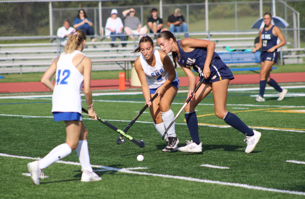 Del Val's Maggie Wichelhaus and South Hunterdon Regional High School's Madeline Dickey and Scarlett Vavrence surround the ball. In this regular-season matchup, the Terriers defeated the Eagles 9-0.