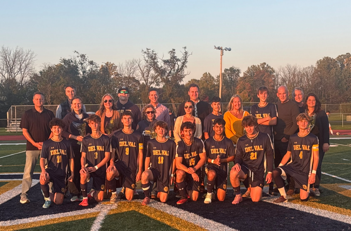 Del Val boys soccer seniors gathered with supporting family and coaches after ceremony dedicated to their attributions. 