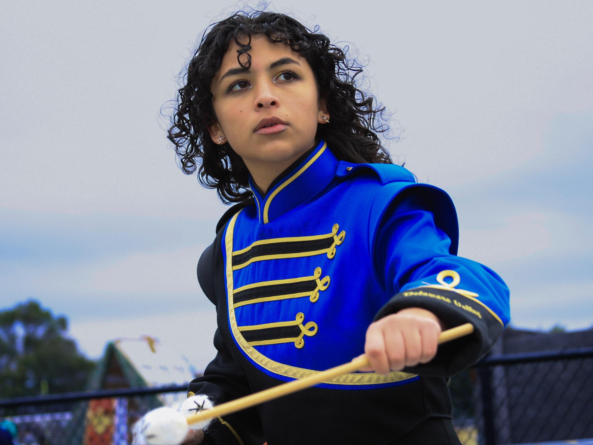 Front ensemble captain Sofia Sliver warms up with the rest of the front ensemble at a competition at Somerville High School. As captain, Sofia gives advice, feedback, and direction to the rest of the front ensemble.