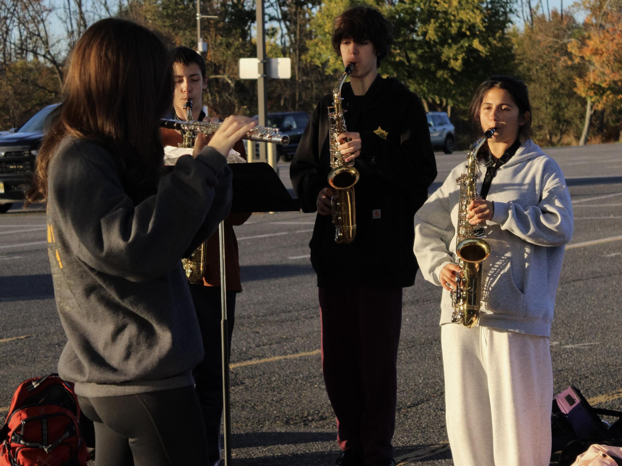 Woodwind section leader Charlotte Lilly leads the woodwinds in a warmup during a section rehearsal. Sectional rehearsals allow students to rehearse just their parts, giving them time to fix problems.